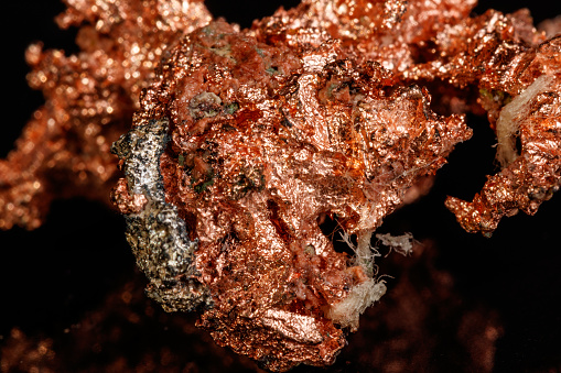 Macro mineral stone Copper on black background close up