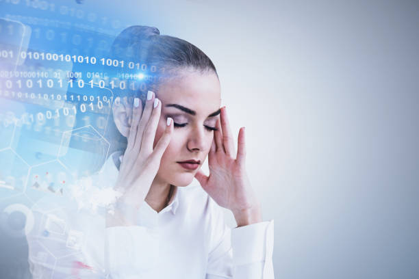 Stressed woman, digital interface Stressed businesswoman portrait near gray wall with binary numbers interface and business infographics. Concept of too much information. Toned image double exposure mock up information overload photos stock pictures, royalty-free photos & images