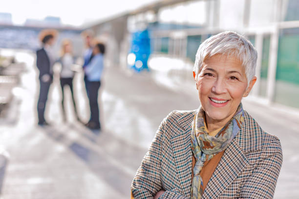 istock Successful business woman leading a group 1088673694