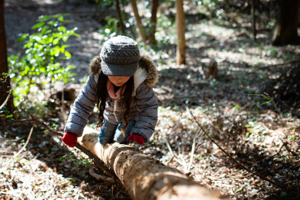 istock Girl playing in the woods 1088675818
