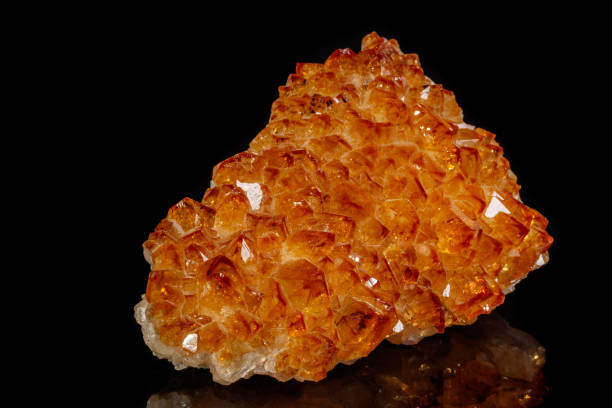 istock Macro mineral stone Citrine in rock in crystals on a black background 1088676364