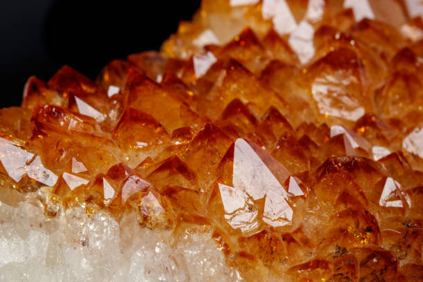 istock Macro mineral stone Citrine in rock in crystals on a black background 1088679142