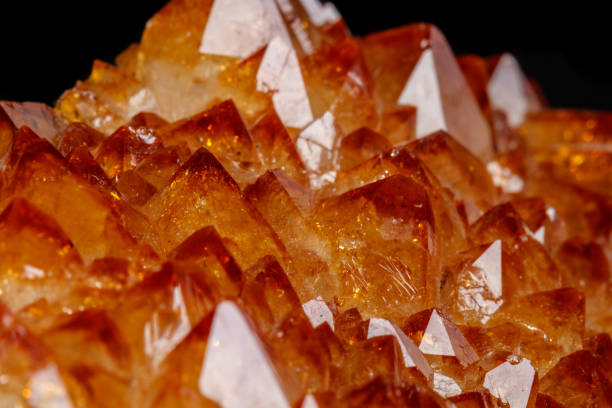 istock Macro mineral stone Citrine in rock in crystals on a black background 1088679176