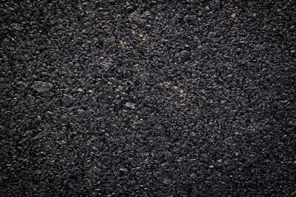 istock close up of new asphalt road texture 1088683448