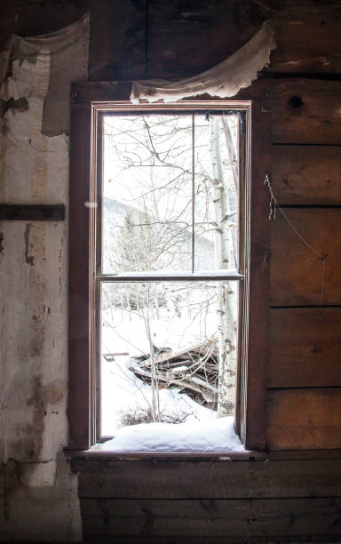 istock Looking out the Window of an Abandoned Cabin 1088691066