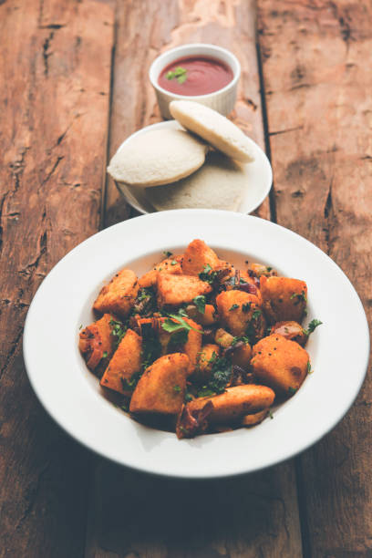 istock Masala fried Idlies - south indian Snack made using with leftover idly served with tomato ketchup. selective focus 1088692216