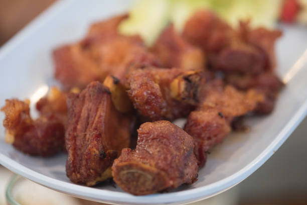 Deep-fried fermented pork ribs on with dish. Appetizer Thai food