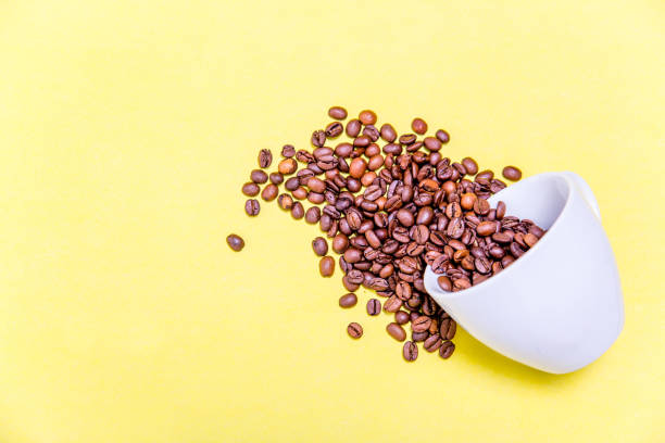 istock Coffee cup and coffee beans on white background 1088698782