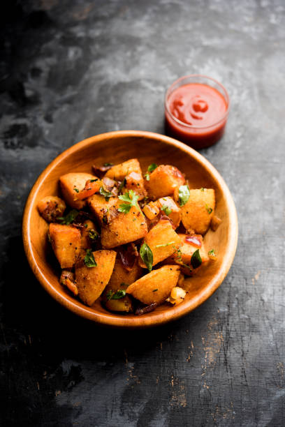 istock Masala fried Idlies - south indian Snack made using with leftover idly served with tomato ketchup. selective focus 1088699086