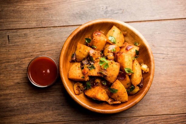 istock Masala fried Idlies - south indian Snack made using with leftover idly served with tomato ketchup. selective focus 1088700360