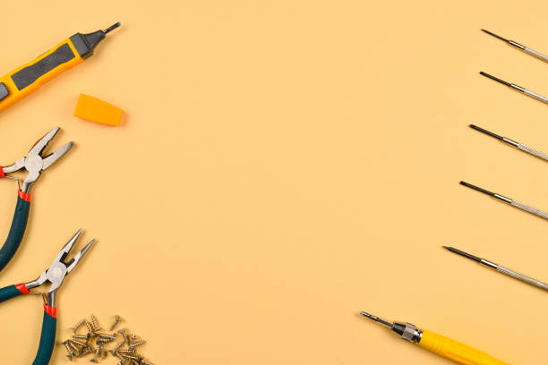 istock Screwdrivers and pliers on orange background 1088700670