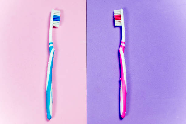 istock toothbrushes and a toothpaste on a colorful background 1088706024