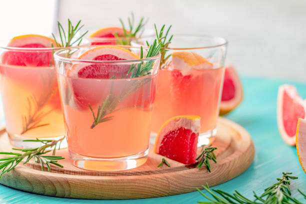 istock Fresh pink alcoholic cocktail with grapefruit, ice and rosemary 1088714896