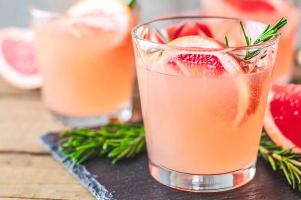 istock Fresh pink alcoholic cocktail with grapefruit, ice and rosemary 1088714898