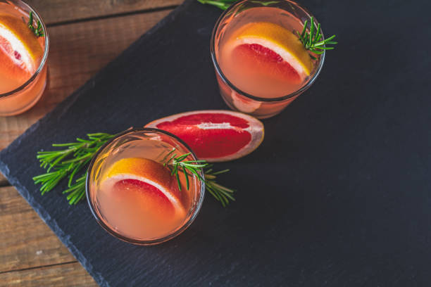 istock Fresh pink alcoholic cocktail with grapefruit, ice and rosemary 1088714900