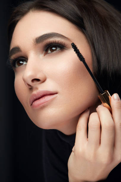 istock Mascara Makeup. Beauty Model Putting Black Mascara On Eyelashes 1088715038