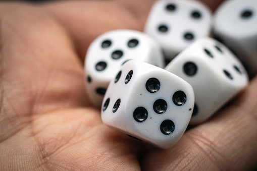 Dice for game on a black background.