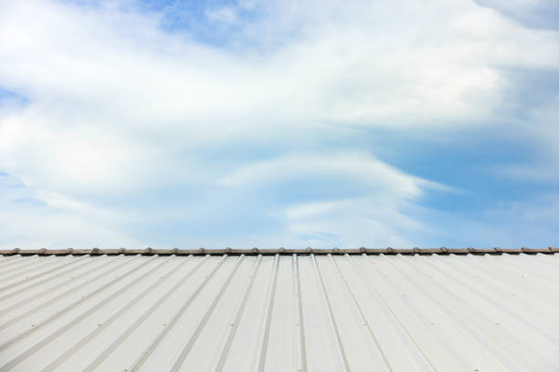 istock metal corrugated roof sheets against cloudy sky background 1088726724