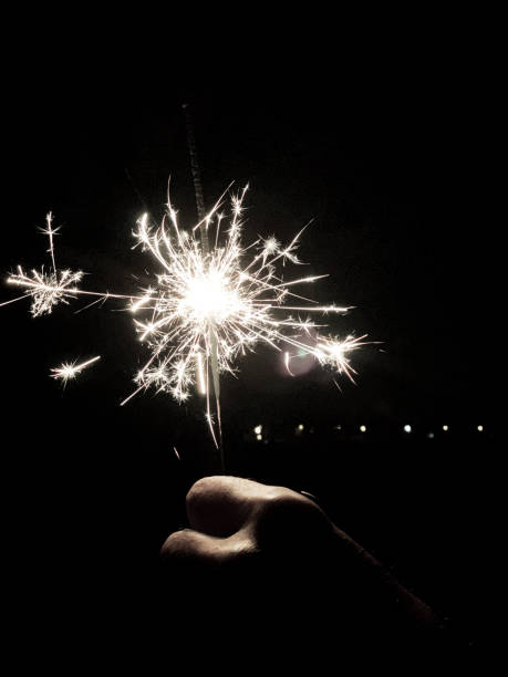 istock Human hand holding a burning sparkler 1088729408
