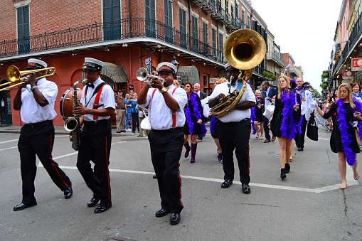 New Orleans, LA, USA October 27, 2015 A group of musicians form a Second Line parade as they march through the French Quarter of New Orleans, Louisiana