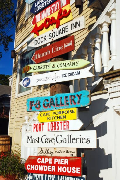 Kennebunkport, ME, USA August 12, 2013 A multitude of signs point to multiple businesses and shopping boutiques in Kennebunkport, Maine