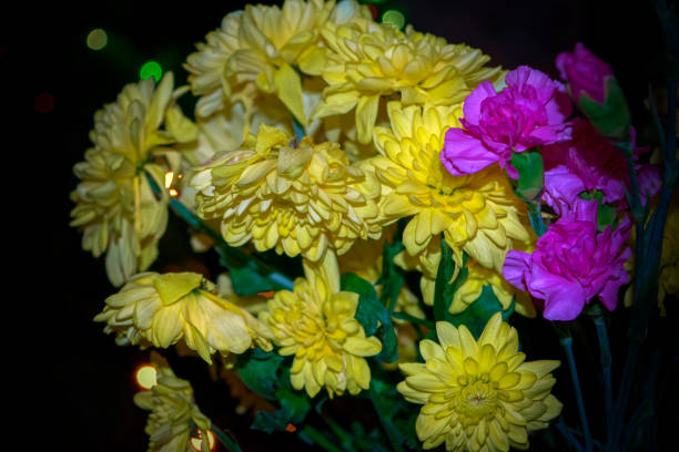 istock Yellow chrysanthemum mixed with pink carnation bouquet with selective focus on yellow and pink flower 1088734248
