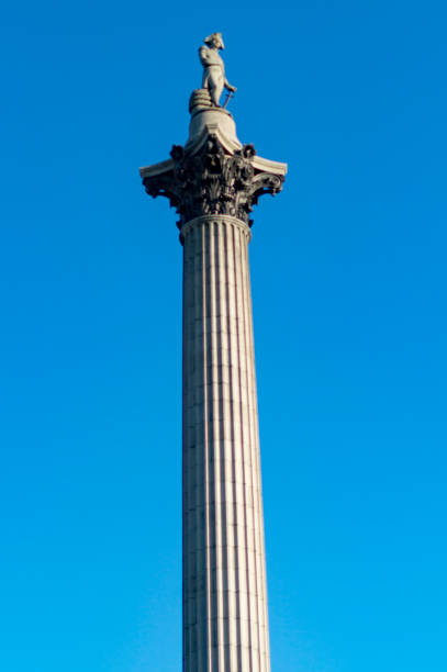 istock Nelson column in trafalgar square standing tall with blue sky 1088738144