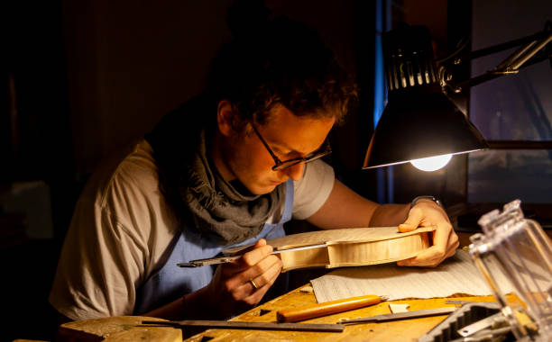 istock male craftsman violin maker 1088745340