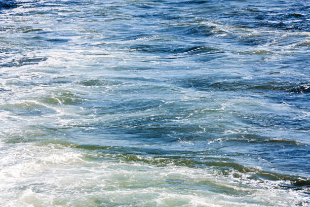 istock Blue sea foaming water background 1088749740