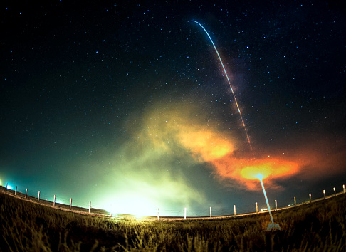 Missile launch at night. Fish eye lens. The elements of this image furnished by NASA.