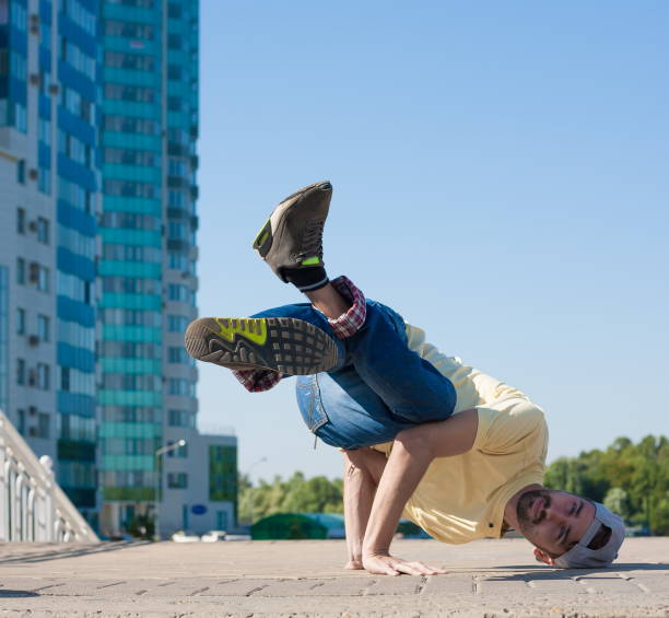 istock Man dancing yellow shirt blue jeans 1088755850