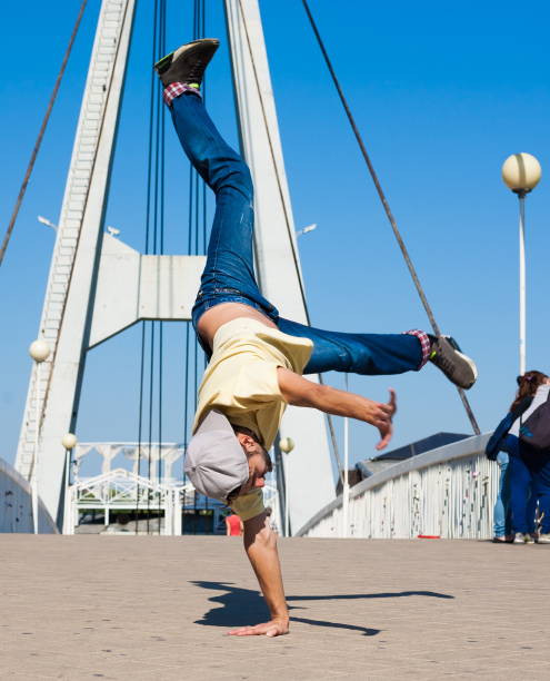 istock Man dancing yellow shirt blue jeans 1088755934