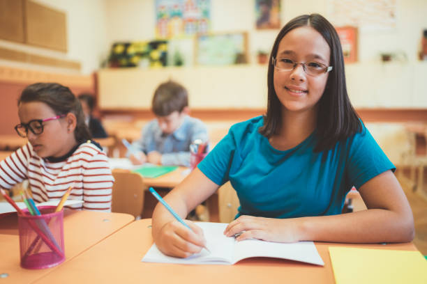 istock School children studying in school 1088760648