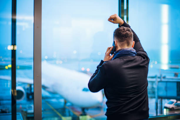 istock Man Talking on Cell Phone at the Airport 1088763188