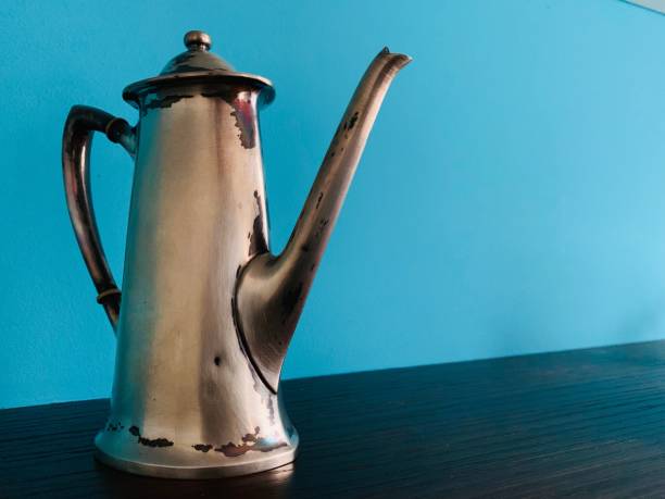 istock Antique Silver Plate Pot on blue background 1088763248