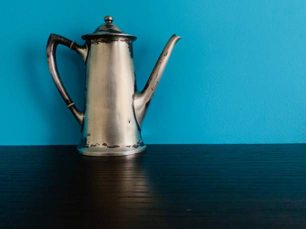 istock Antique Silver Plate Pot on blue background 1088763292
