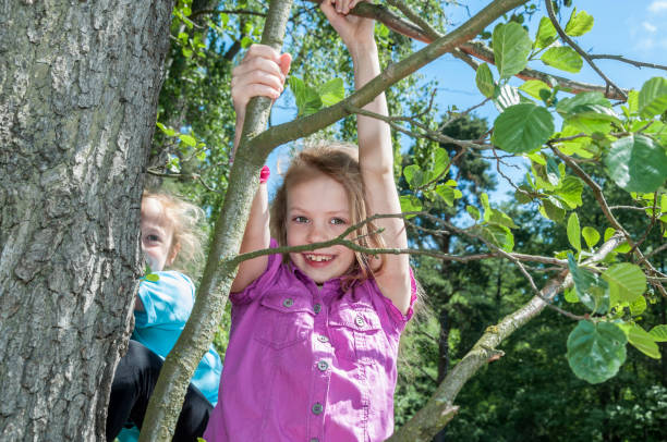 istock Happy girls playing in park 1088770022