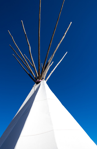 White Teepee (Top Section) Against Vibrant Blue Sky