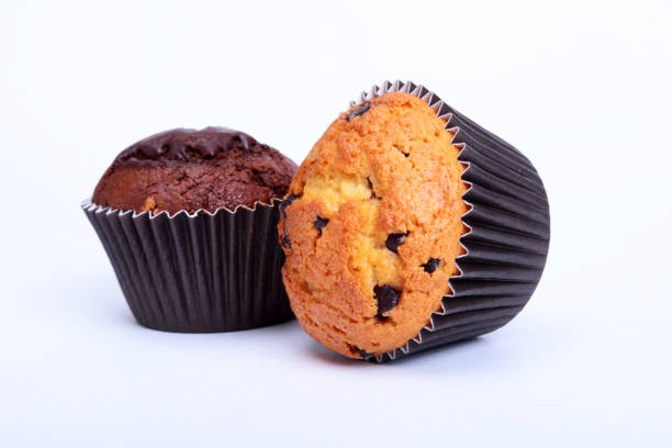 istock Assorted with Delicious homemade muffin, cupcake with raisins, nuts and chocolate isolated on white background. 1088774870