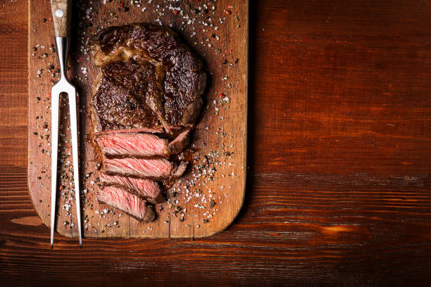 ribbey steak of marbled beef tasty and fresh, very juicy ribbey steak of marbled beef, on a wooden table. high quality kitchen equipment stock pictures, royalty-free photos & images