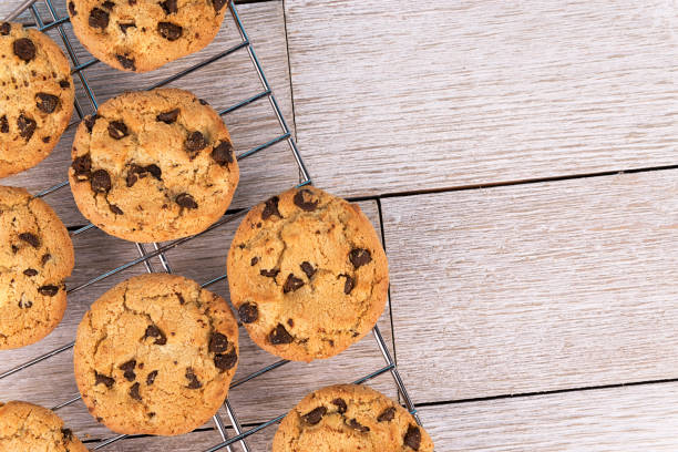 istock Top view of chocolate chip cookies on a cooling rack. 1088783940