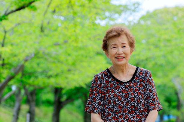 istock Elderly women with green background 1088792976
