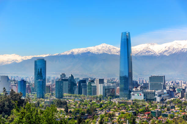 Buildings in Santiago del Chile Plenty of business buildings in Santiago del Chile with trees in the foreground and the Andes mountains in the background sanhattan stock pictures, royalty-free photos & images