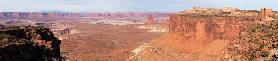 A panoramic view from Candlestick Tower Overlook with the Henry Mountains in the distance. Located in the Island in the Sky district of Canyon Lands National Park.