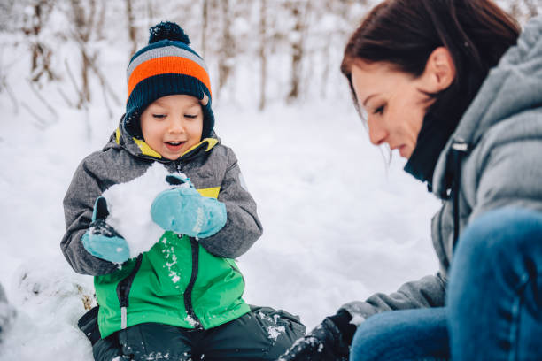 istock Mother and son playing in the snow 1088813726