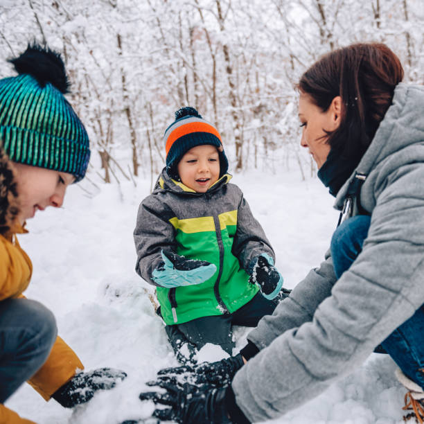 istock Family playing in the snow 1088816118
