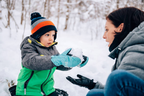 istock Mother and son playing in the snow 1088816148
