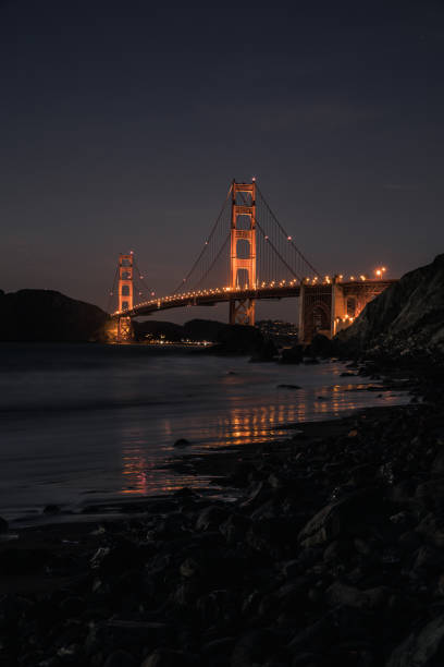 istock Golden Gate Bridge night with reflection in sand on the beach in San Francisco 1088817906
