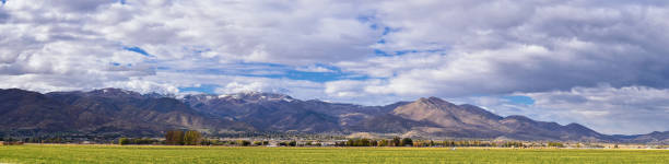 Panoramic Landscape view from Kamas and Samak off Utah Highway 150, view of backside of Mount Timpanogos near Jordanelle Reservoir in the Wasatch back Rocky Mountains, and Cloudscape. America. stock photo