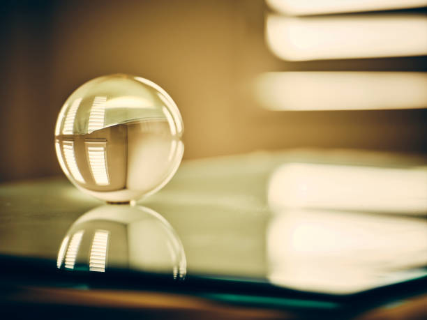 A golden color toned clear glass sphere in a home interior.